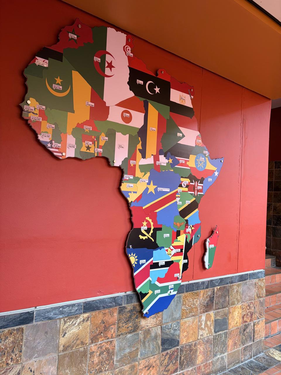 Map of Africa made of national flags on a wall